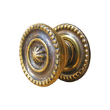 Sheraton style knob with backplate in antique brass finish - ABC Ironmongery