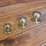 Mushroom knob with backplate in brass showing range of sizes available - ABC Ironmongery