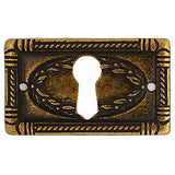 Continental style escutcheon 1¾" x 1" in antique brass - ABC Ironmongery
